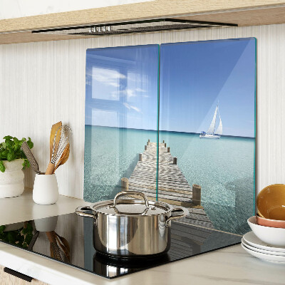 Glass kitchen board Pier over the turquoise sea