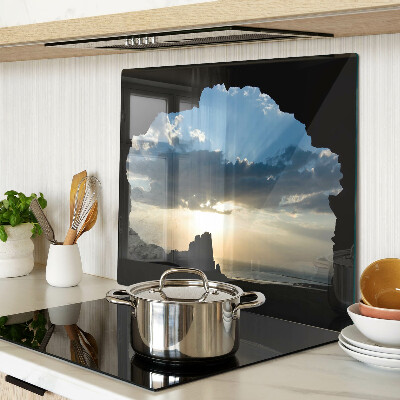 Glass kitchen board Sunset behind the clouds