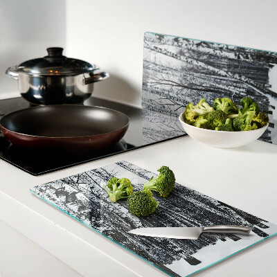 Glass kitchen board Winter forest with birches
