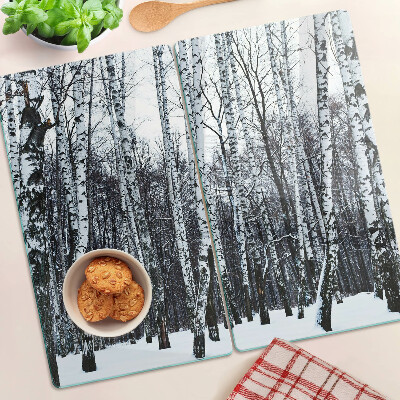 Glass kitchen board Winter forest with birches