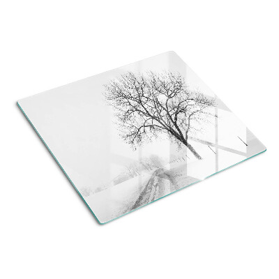 Glass kitchen board Empty winter landscape with a tree
