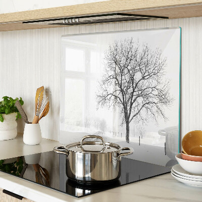 Glass kitchen board Empty winter landscape with a tree