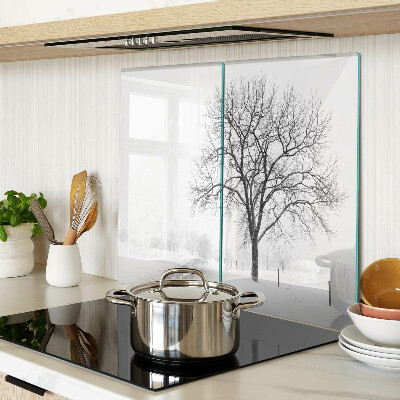 Glass kitchen board Empty winter landscape with a tree