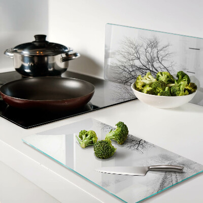 Glass kitchen board Empty winter landscape with a tree