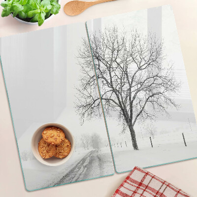 Glass kitchen board Empty winter landscape with a tree