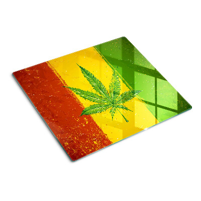 Glass kitchen board Hemp leaf on a colored background