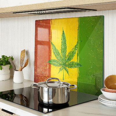 Glass kitchen board Hemp leaf on a colored background