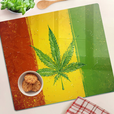 Glass kitchen board Hemp leaf on a colored background
