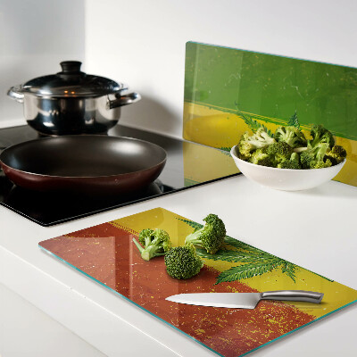 Glass kitchen board Hemp leaf on a colored background