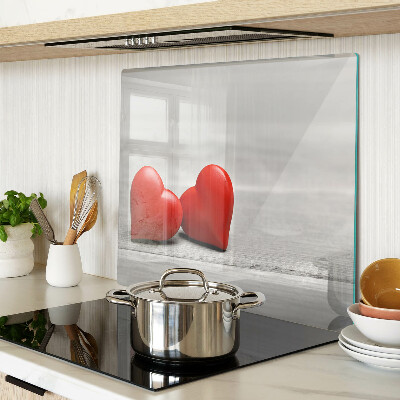 Glass chopping board Red hearts on a wooden background