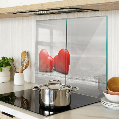 Glass chopping board Red hearts on a wooden background