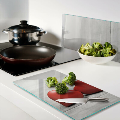Glass chopping board Red hearts on a wooden background