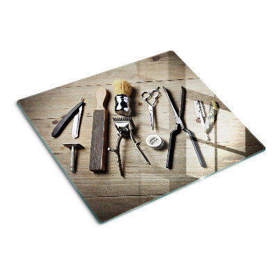 Glass kitchen board Hairdressing tools on a wooden background