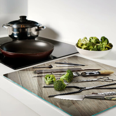 Glass kitchen board Hairdressing tools on a wooden background