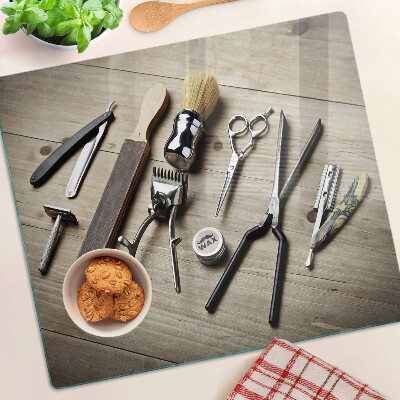 Glass kitchen board Hairdressing tools on a wooden background