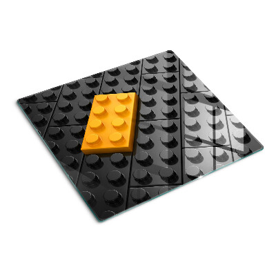 Glass chopping board LEGO bricks on a black background