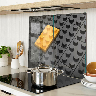 Glass chopping board LEGO bricks on a black background
