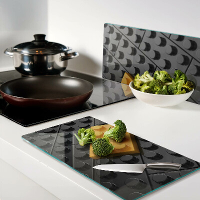 Glass chopping board LEGO bricks on a black background