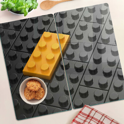 Glass chopping board LEGO bricks on a black background