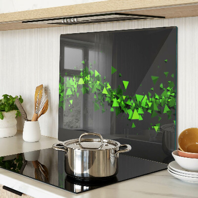 Glass kitchen board Green triangles on a black background