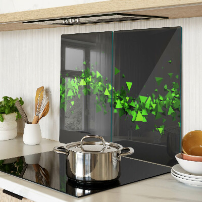 Glass kitchen board Green triangles on a black background