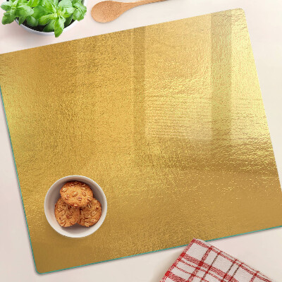 Glass chopping board Golden surface with reflections