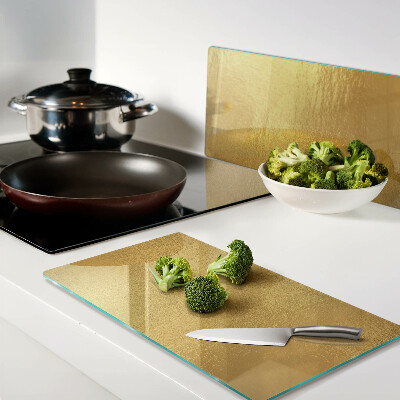 Glass chopping board Golden surface with reflections