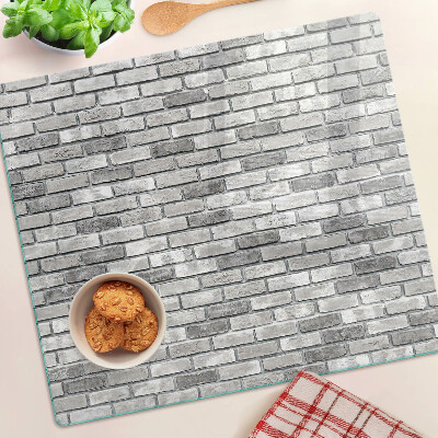 Glass chopping board Brick wall