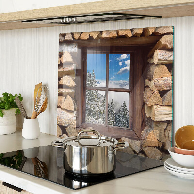 Glass chopping board View of a winter landscape through the window