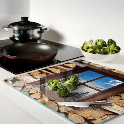 Glass chopping board View of a winter landscape through the window