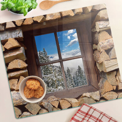 Glass chopping board View of a winter landscape through the window