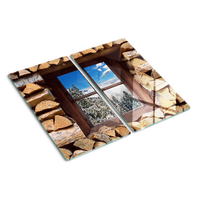 Glass chopping board View of a winter landscape through the window