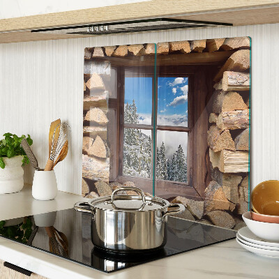 Glass chopping board View of a winter landscape through the window
