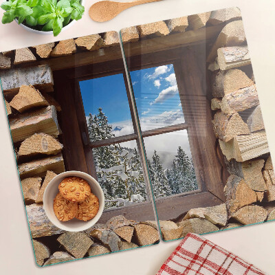 Glass chopping board View of a winter landscape through the window