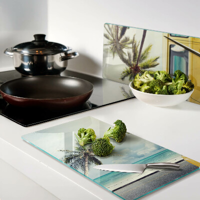 Glass kitchen board Beach with palm trees and a car