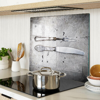 Glass kitchen board Cutlery on a concrete background