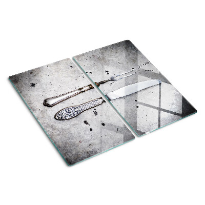 Glass kitchen board Cutlery on a concrete background