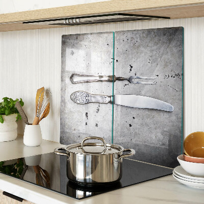 Glass kitchen board Cutlery on a concrete background