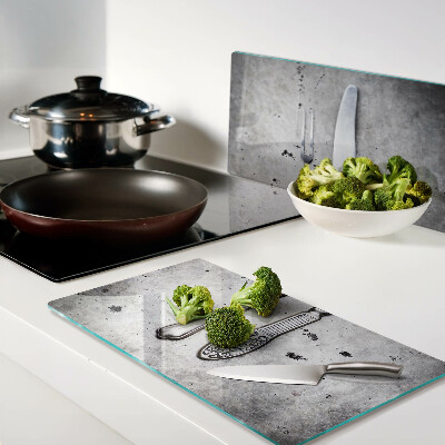 Glass kitchen board Cutlery on a concrete background