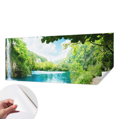 Baby room wall mural with a natural oasis design