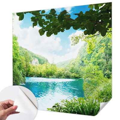 Baby room wall mural with a natural oasis design