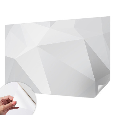 Removable wall mural with a gray triangle pattern
