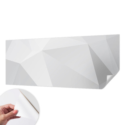 Removable wall mural with a gray triangle pattern
