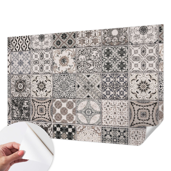 Self-adhesive wall mural featuring tile patterns