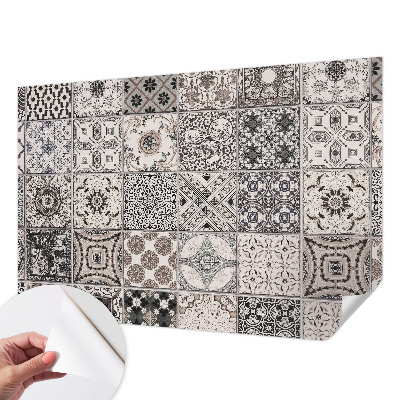 Self-adhesive wall mural featuring tile patterns