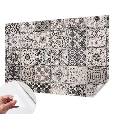 Self-adhesive wall mural featuring tile patterns