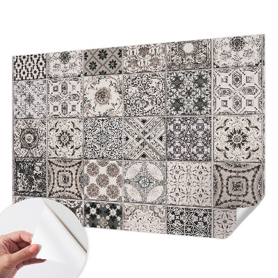 Self-adhesive wall mural featuring tile patterns