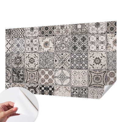 Self-adhesive wall mural featuring tile patterns