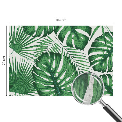 Removable wall mural with a tropical leaves design