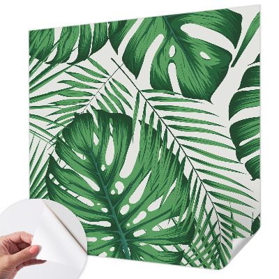 Removable wall mural with a tropical leaves design